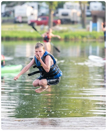 kid jumping into the water